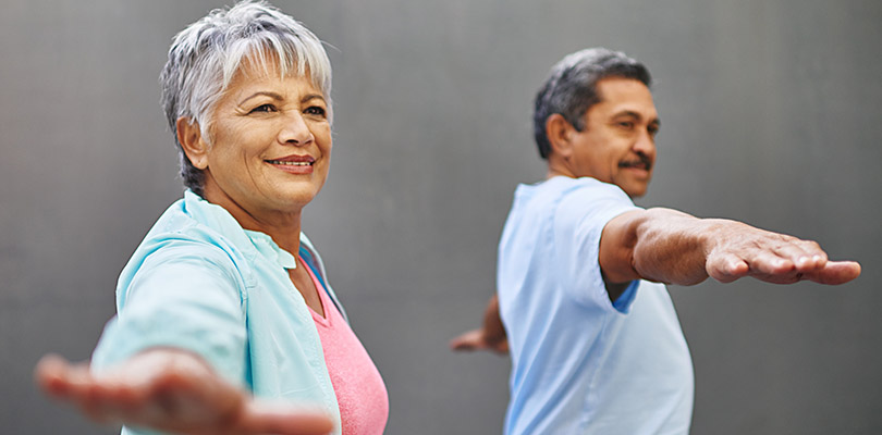 Two mature adults are exercising